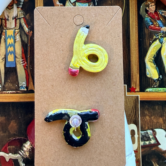 Front and back of looped yellow pencil stud earrings, showing the post and round backing.