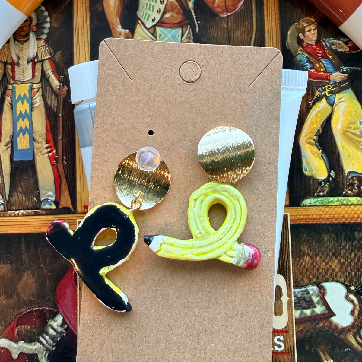 Front and back of looped yellow pencil dangle earrings, showing the gold-tone top and backing.