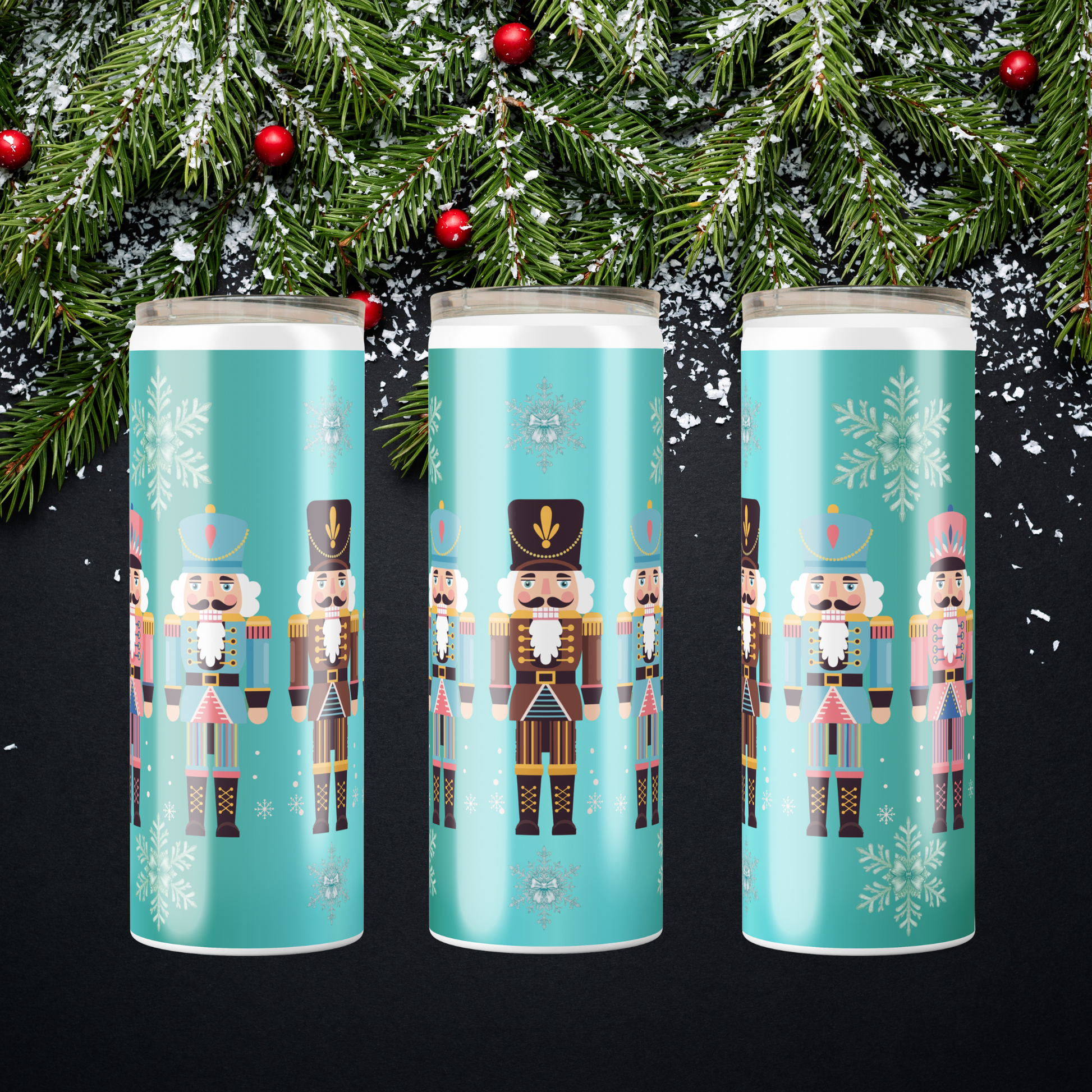 Teal Winter Tumblers made to order by hand showcasing 5 nutcracker and snowflake design by SomeNerdStuff.