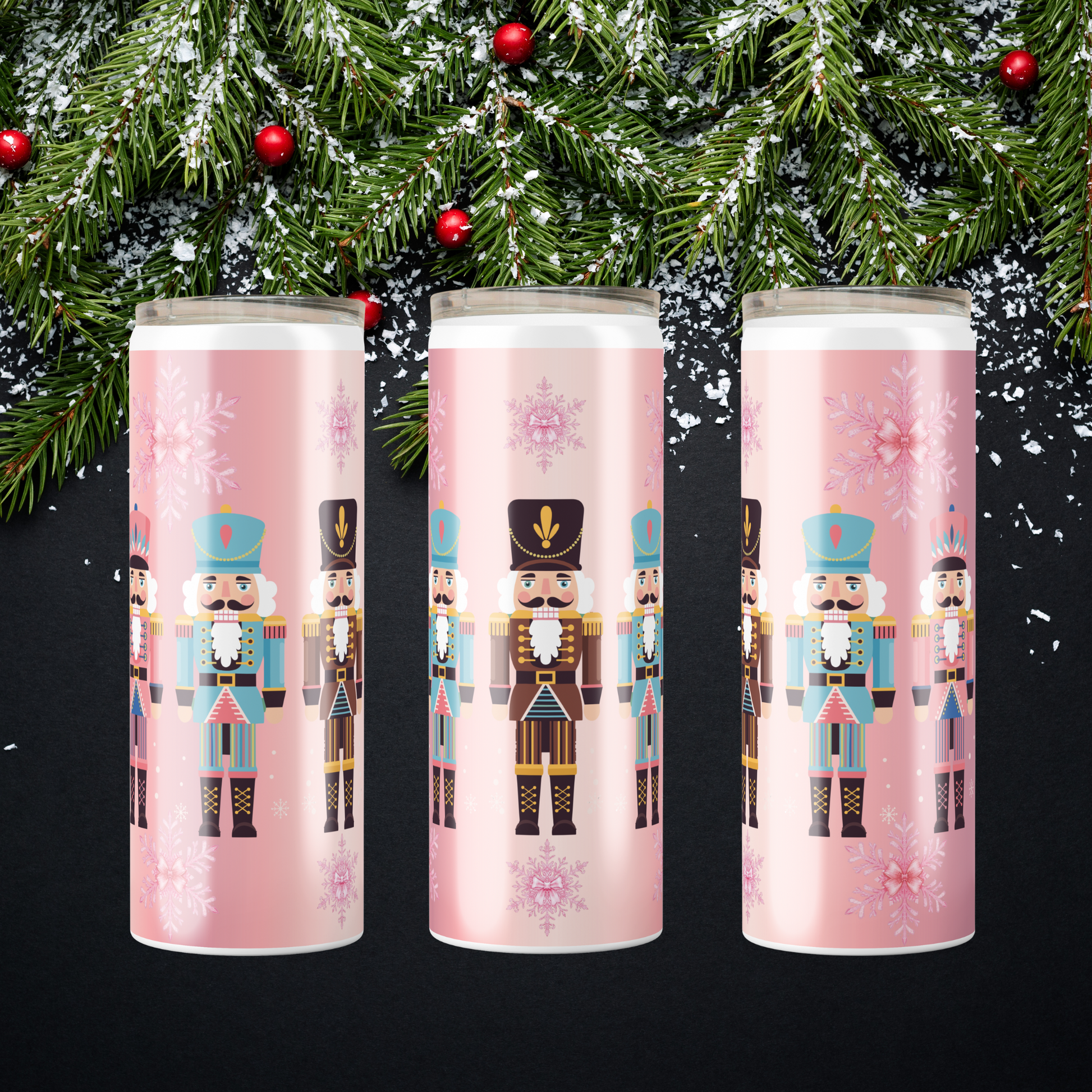 Illustrations of nutcrackers on a pink background with snowflakes to be ordered for a 20oz cup from SomeNerdStuff.