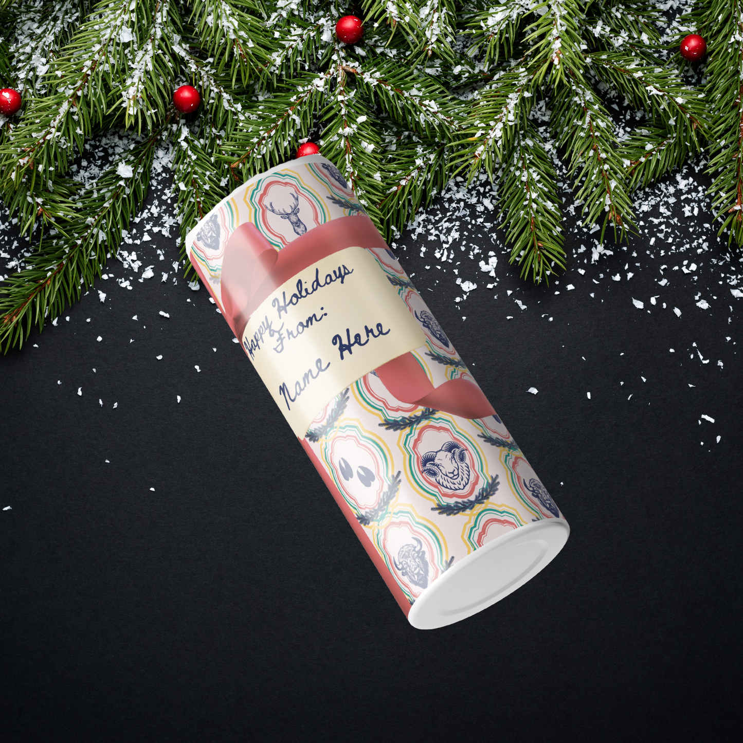 Decorative Tumbler with long horn sheep, bison, tracks, and deer all seen in a gift wrapping background and personalization