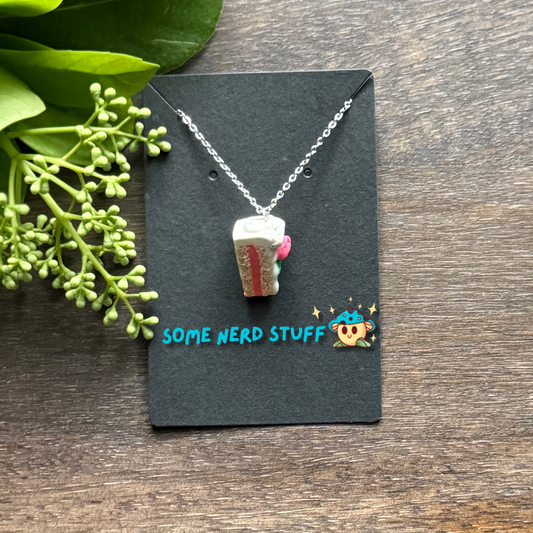 Pretty in Pink Polymer Clay necklace top view with pink rose and green petals side view
