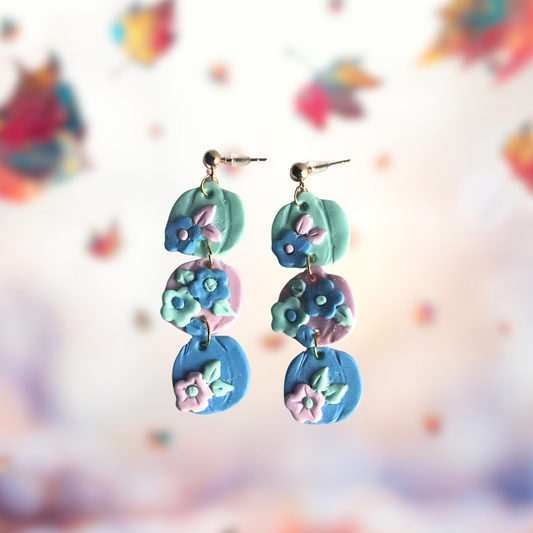 Three Pastel Polymer Clay Pumpkin and flower earrings made by SomeNerdStuff