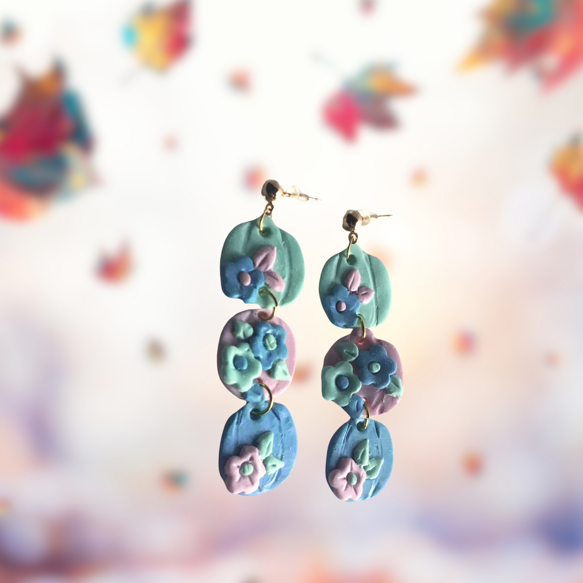 Three Pastel Polymer Clay Pumpkin and flower earrings made by SomeNerdStuff
