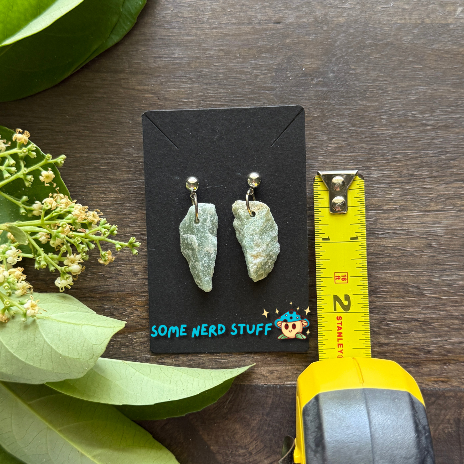 Rough Aquarmine Gemstone Dangling Earrings created by SomeNerdStuff pictured with a measureing tape
