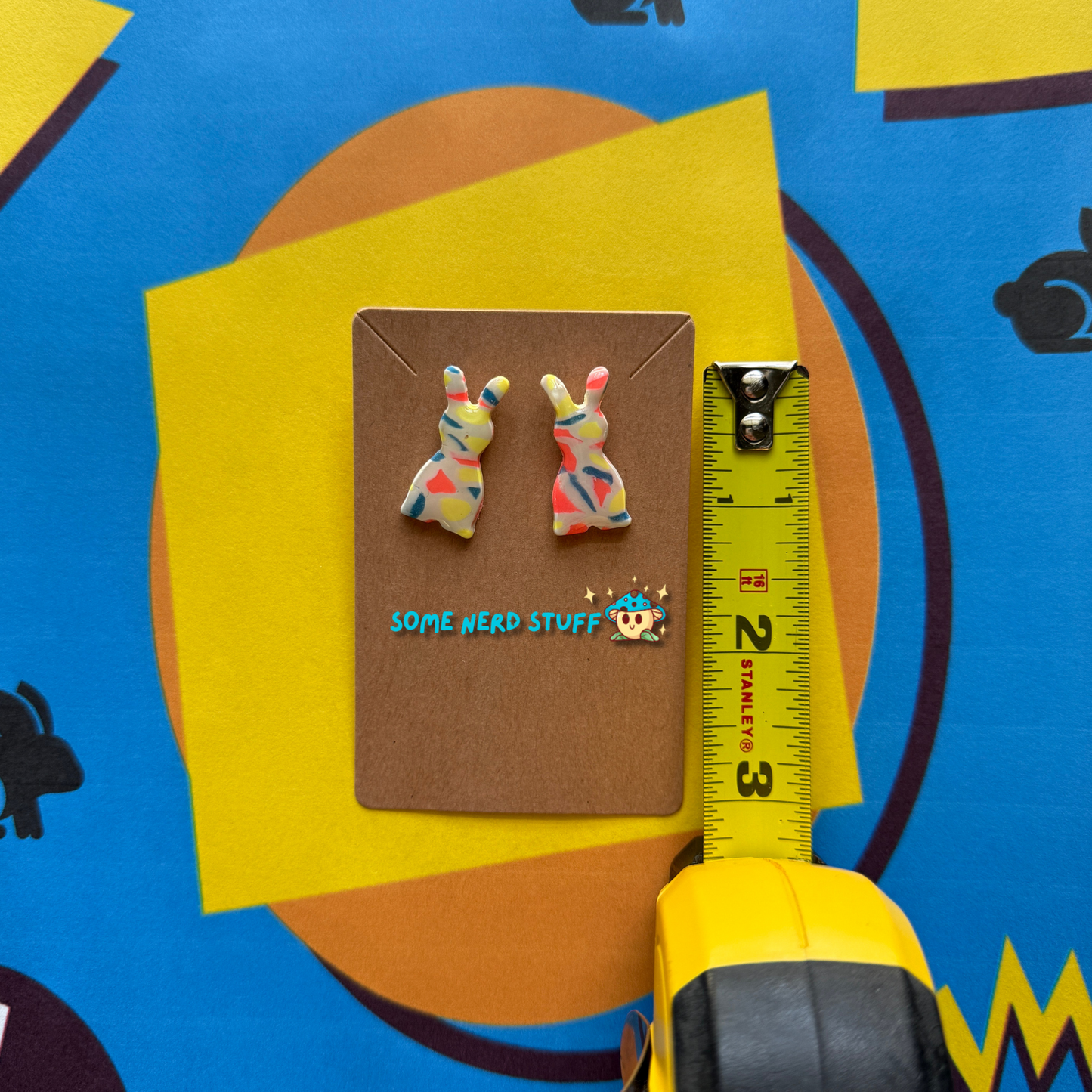 Carrot Silhouette Polymer Clay Earrings inspired by Saved by the Bell 90s show multicolor shown with measuring tape made by SomenerdStuff