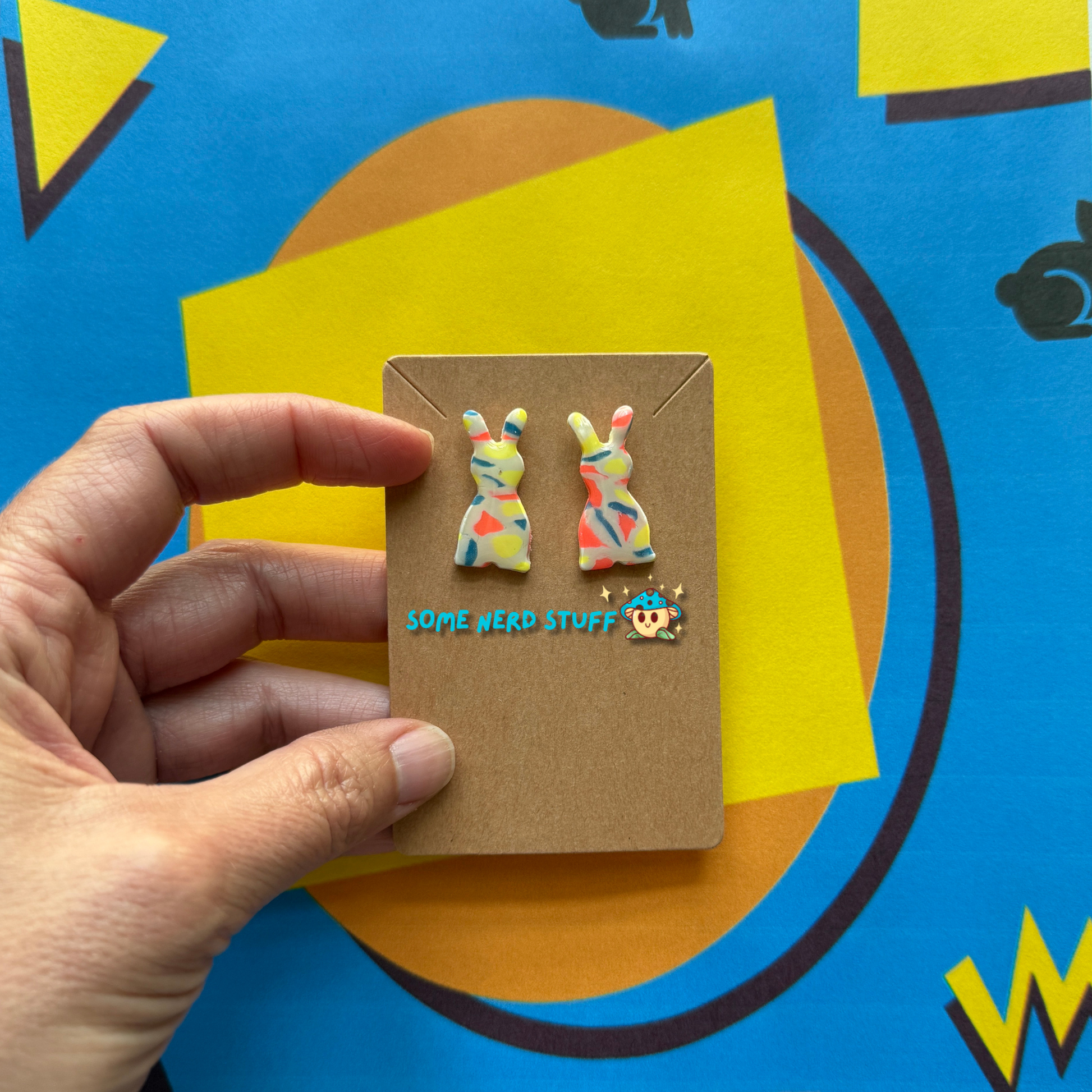 Carrot Silhouette Polymer Clay Earrings inspired by Saved by the Bell 90s show multicolor held by hand to show size made by SomenerdStuff