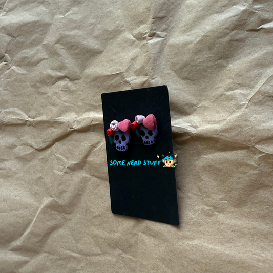 Polymer Clay Stud earrings with purple skulls, pink and red roses, with pink hearts side view made by SomeNerdStuff