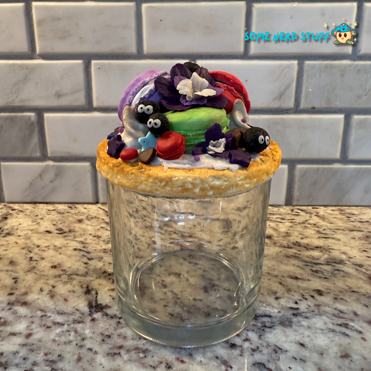 Soot Sprite Stash Jar topped with polymer clay macarooms, Soot Sprites, chocolate pieces, orchids.