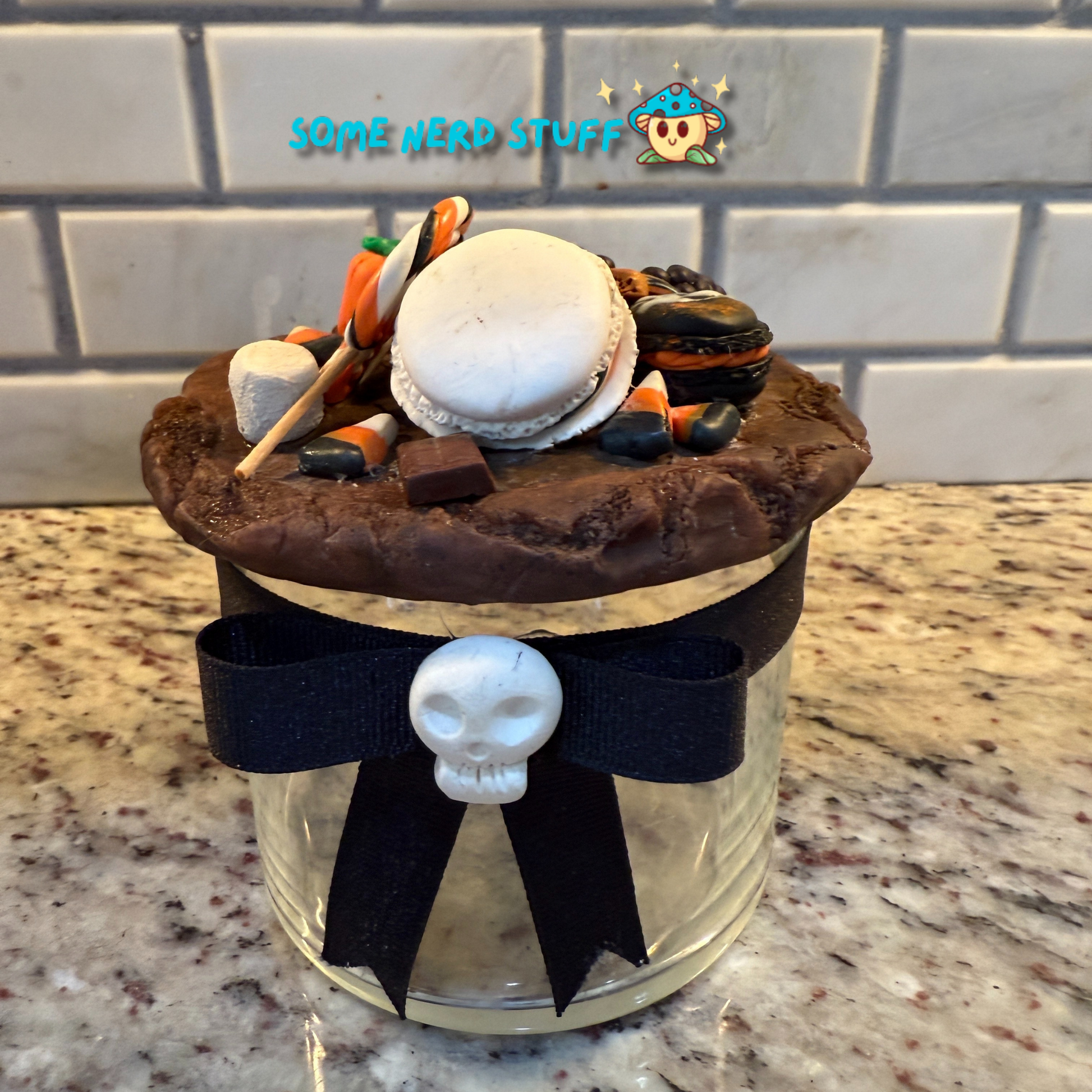 Spooktacular Stash Jar made with polymer clay including macarons, marshmellos, candy lollipop, candy corn, and candy corn pumpkin front
