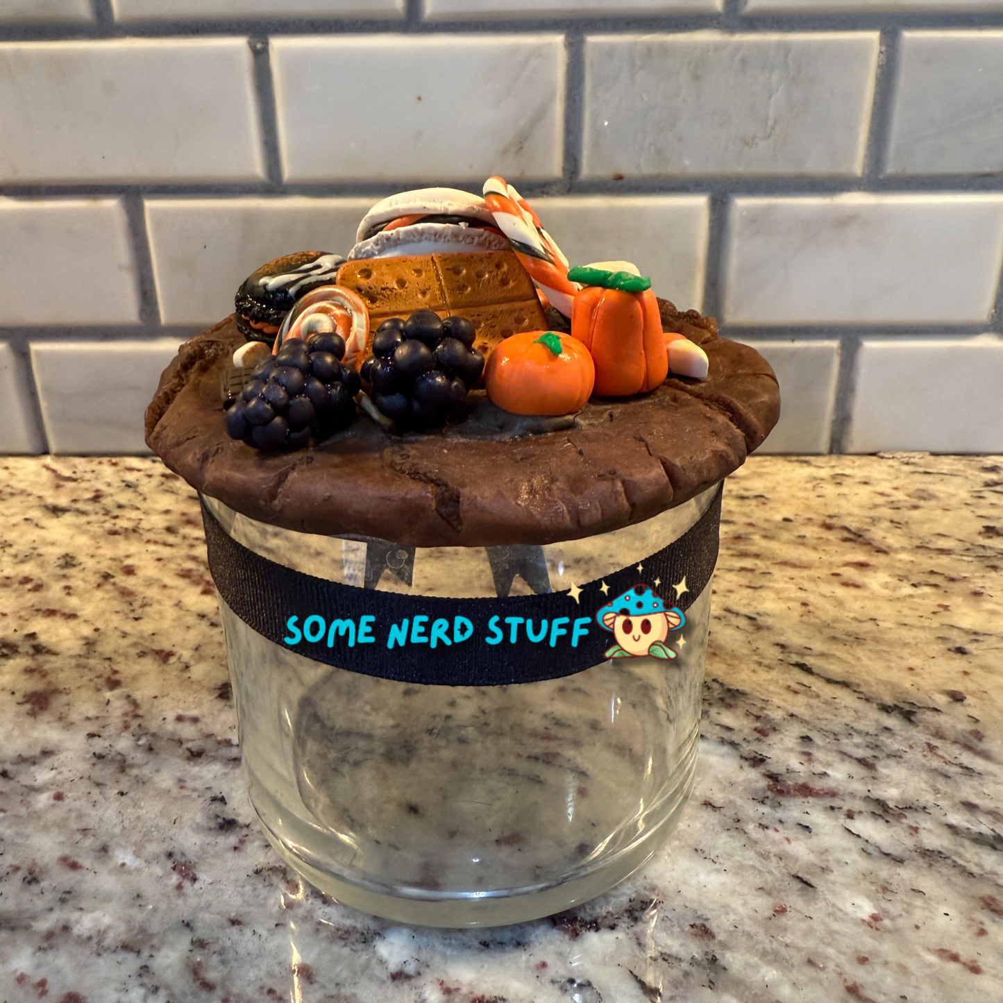 Spooktacular Stash Jar made with polymer clay including macarons, marshmellos, candy lollipop, candy corn, and candy corn pumpkin back