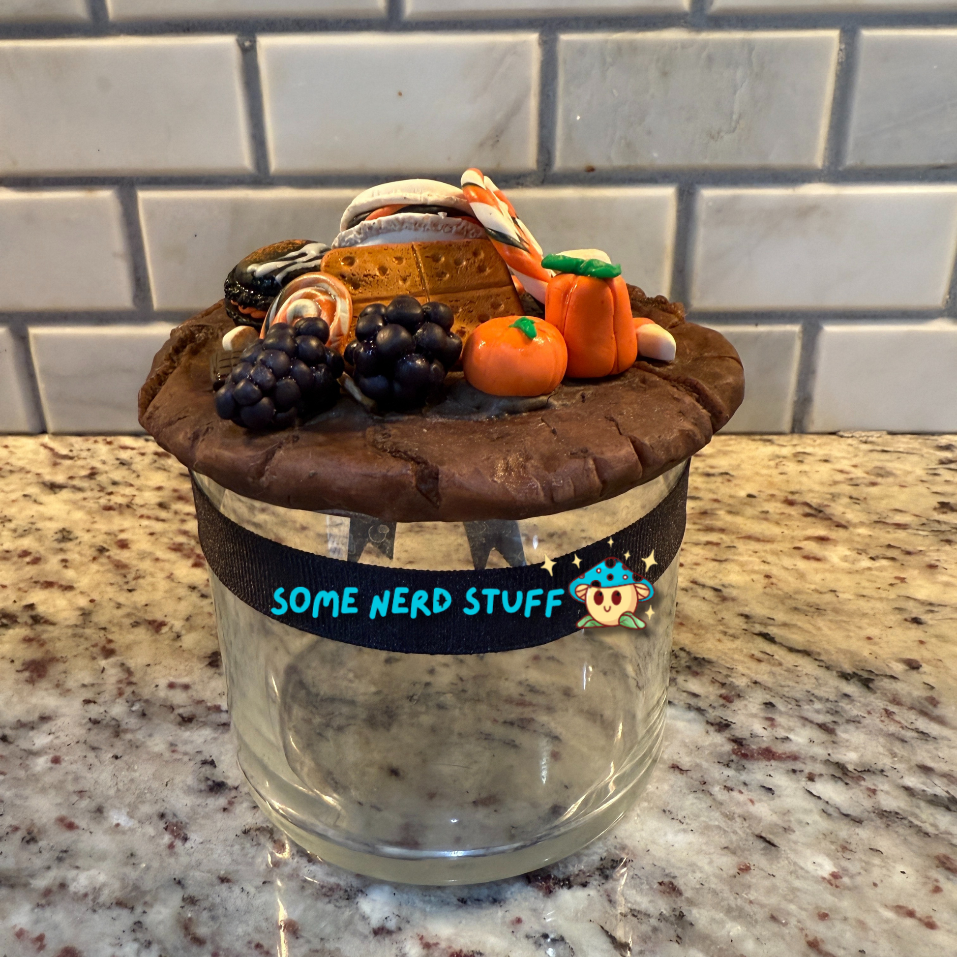 Spooktacular Stash Jar made with polymer clay including macarons, marshmellos, candy lollipop, candy corn, and candy corn pumpkin back