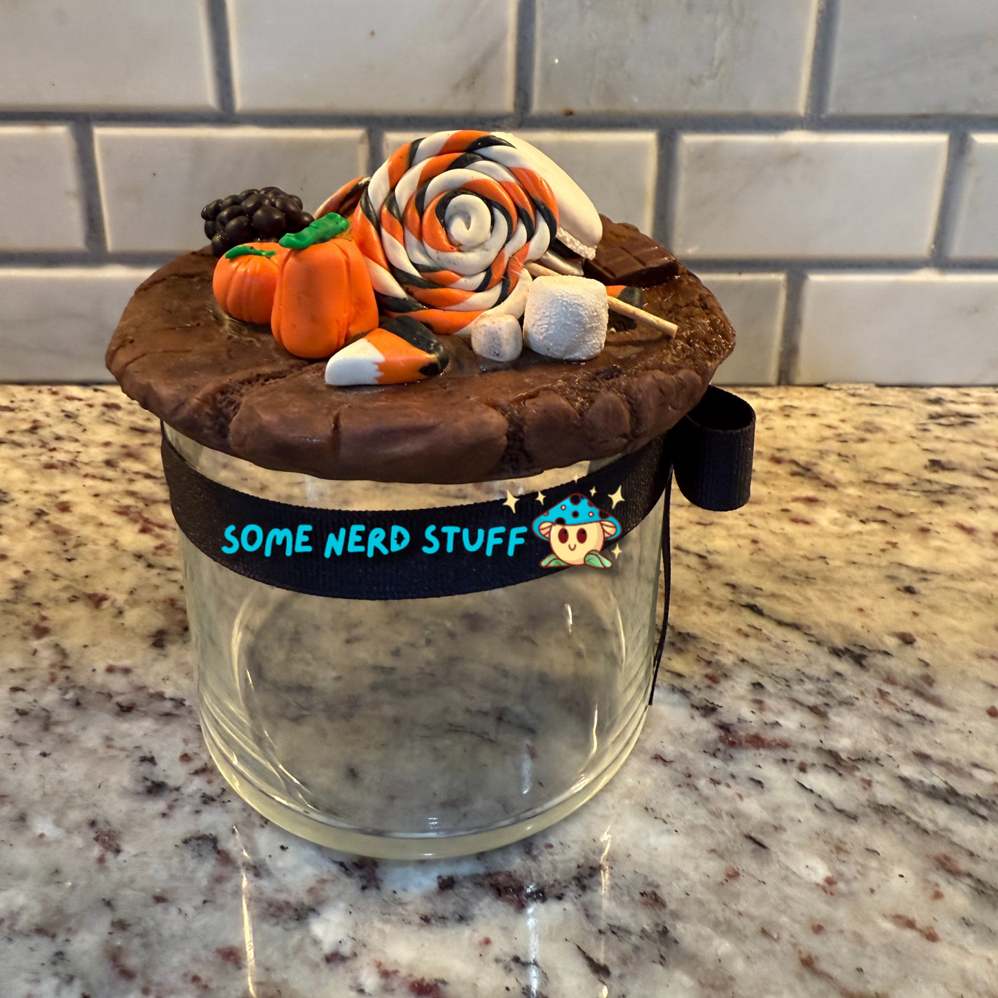 Spooktacular Stash Jar made with polymer clay including macarons, marshmellos, candy lollipop, candy corn, and candy corn pumpkin back too