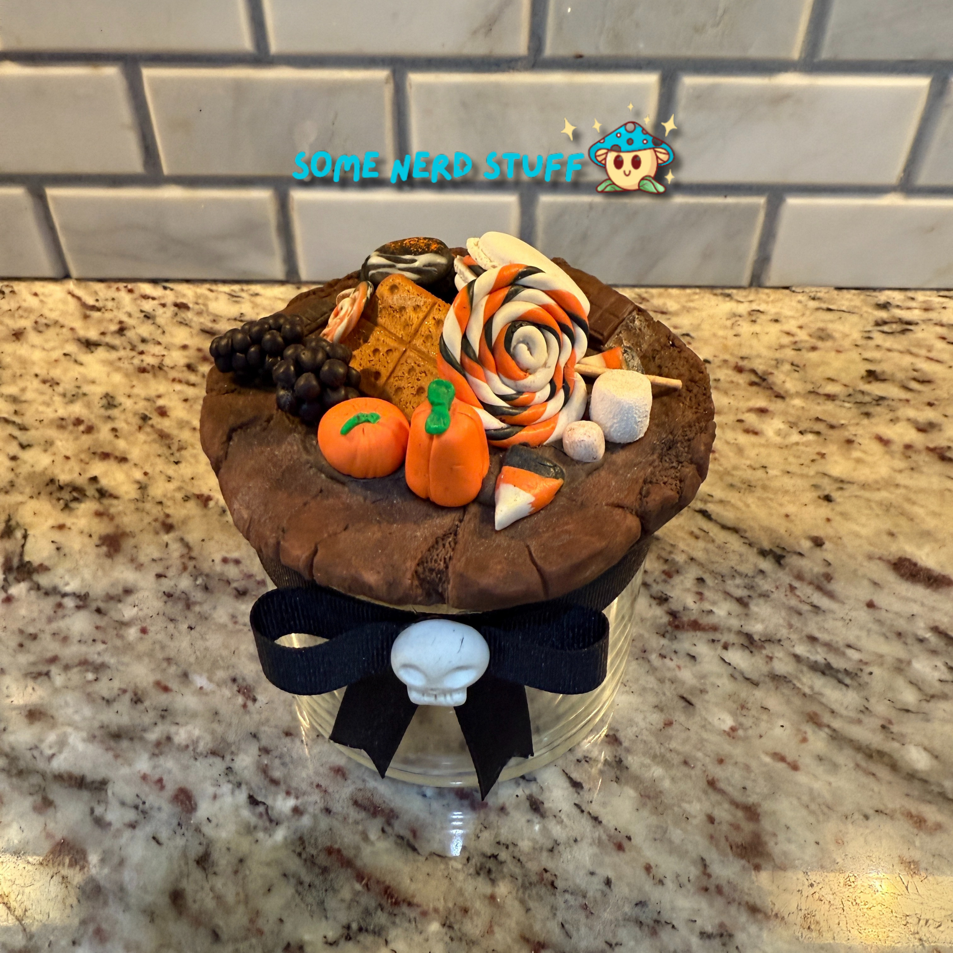 Spooktacular Stash Jar made with polymer clay including macarons, marshmellos, candy lollipop, candy corn, and candy corn pumpkin top skull top jar