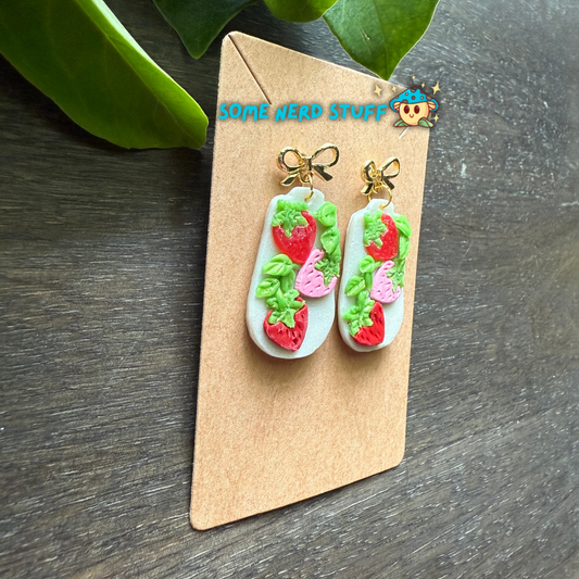 Pair of earrings triple polymer clay earrings set on bows that dangle