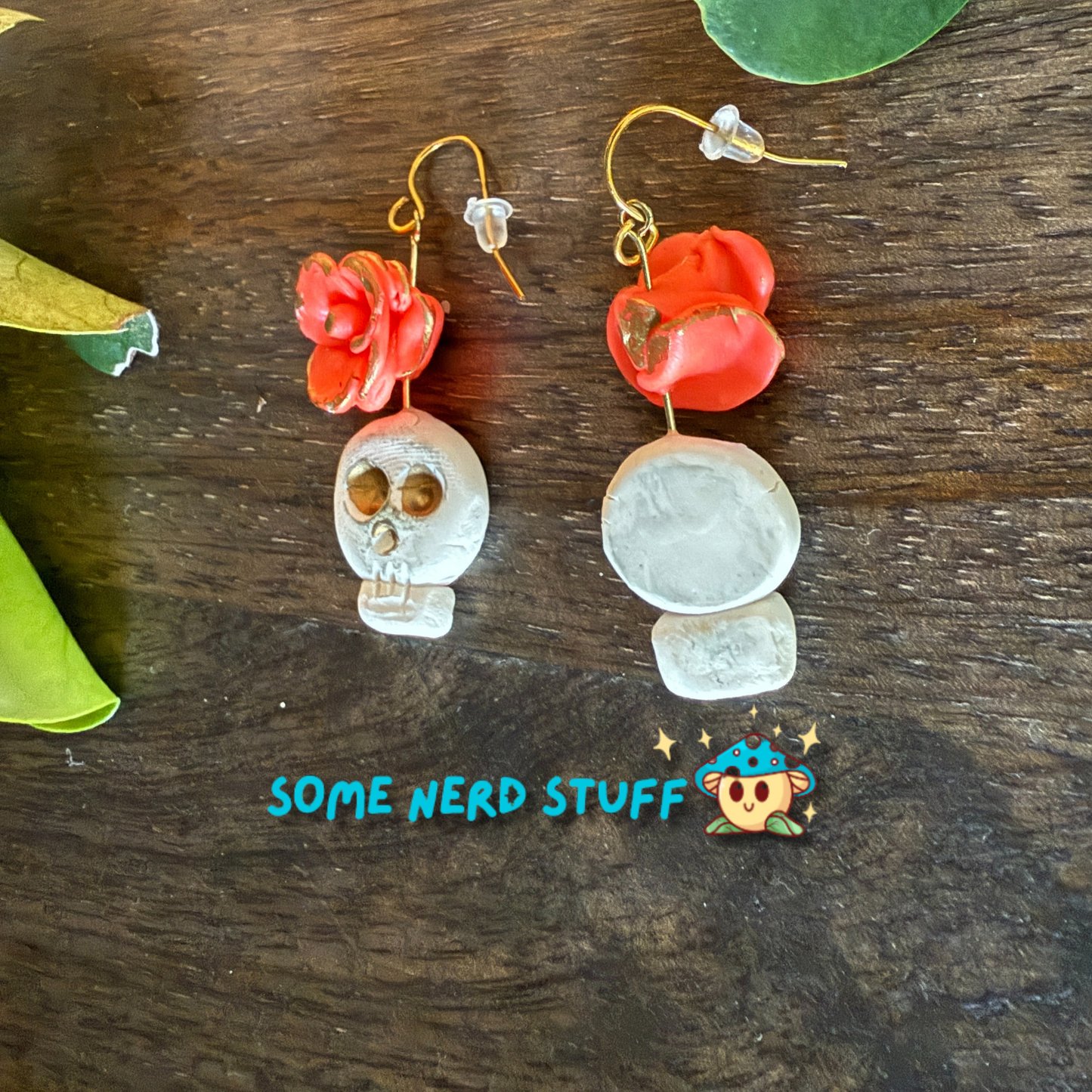 Polymer Clay Wild Rose and Aged Skull highlighted with gold Earrings made by SomeNerdStuff