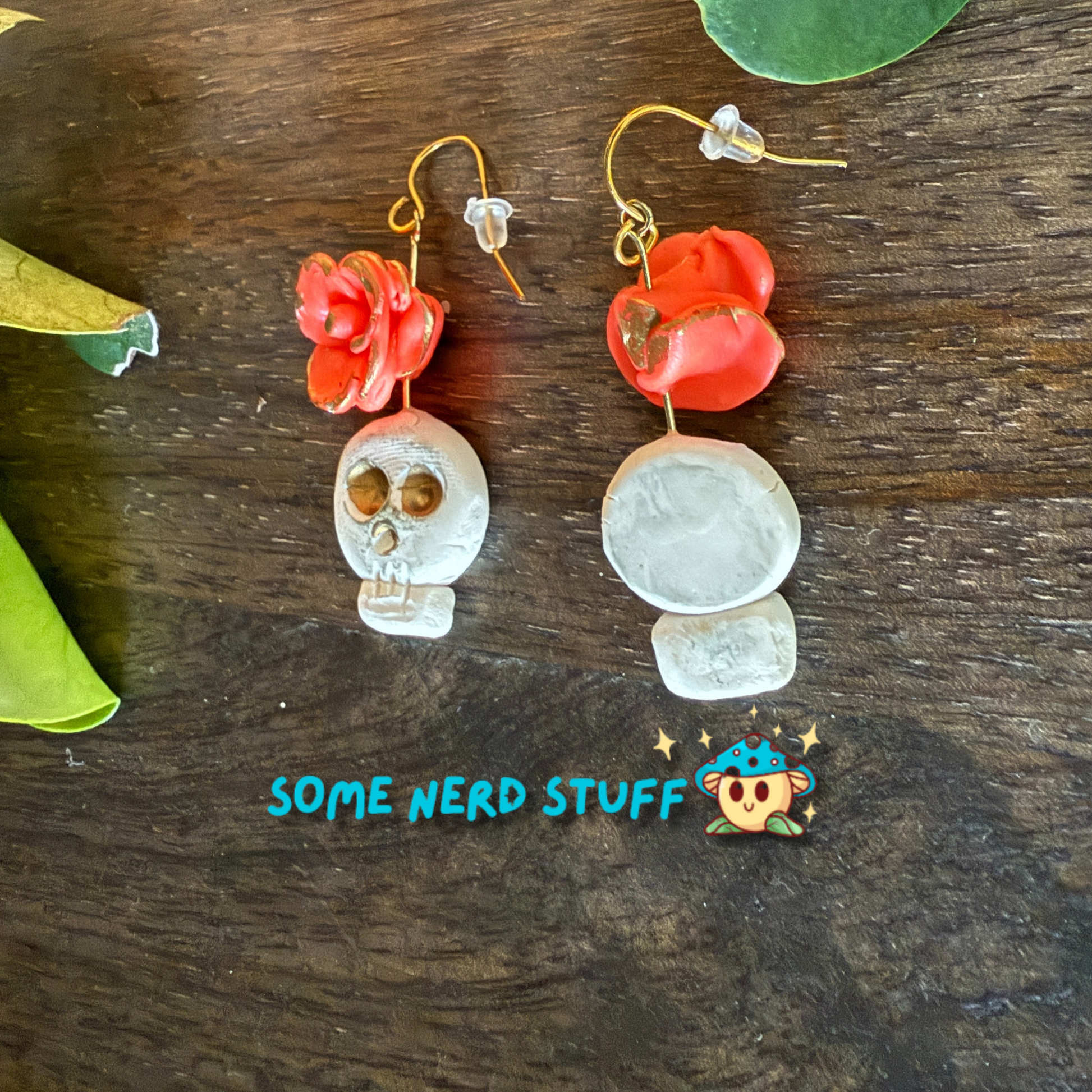 Polymer Clay Wild Rose and Aged Skull highlighted with gold Earrings made by SomeNerdStuff