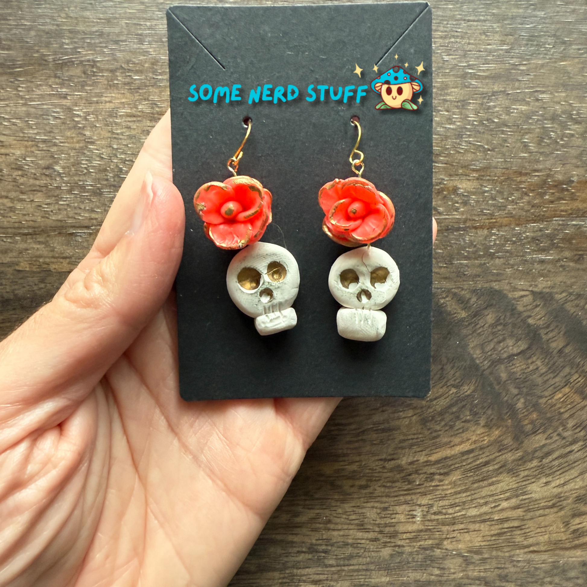 Polymer Clay Wild Rose and Aged Skull highlighted with gold Earrings made by SomeNerdStuff