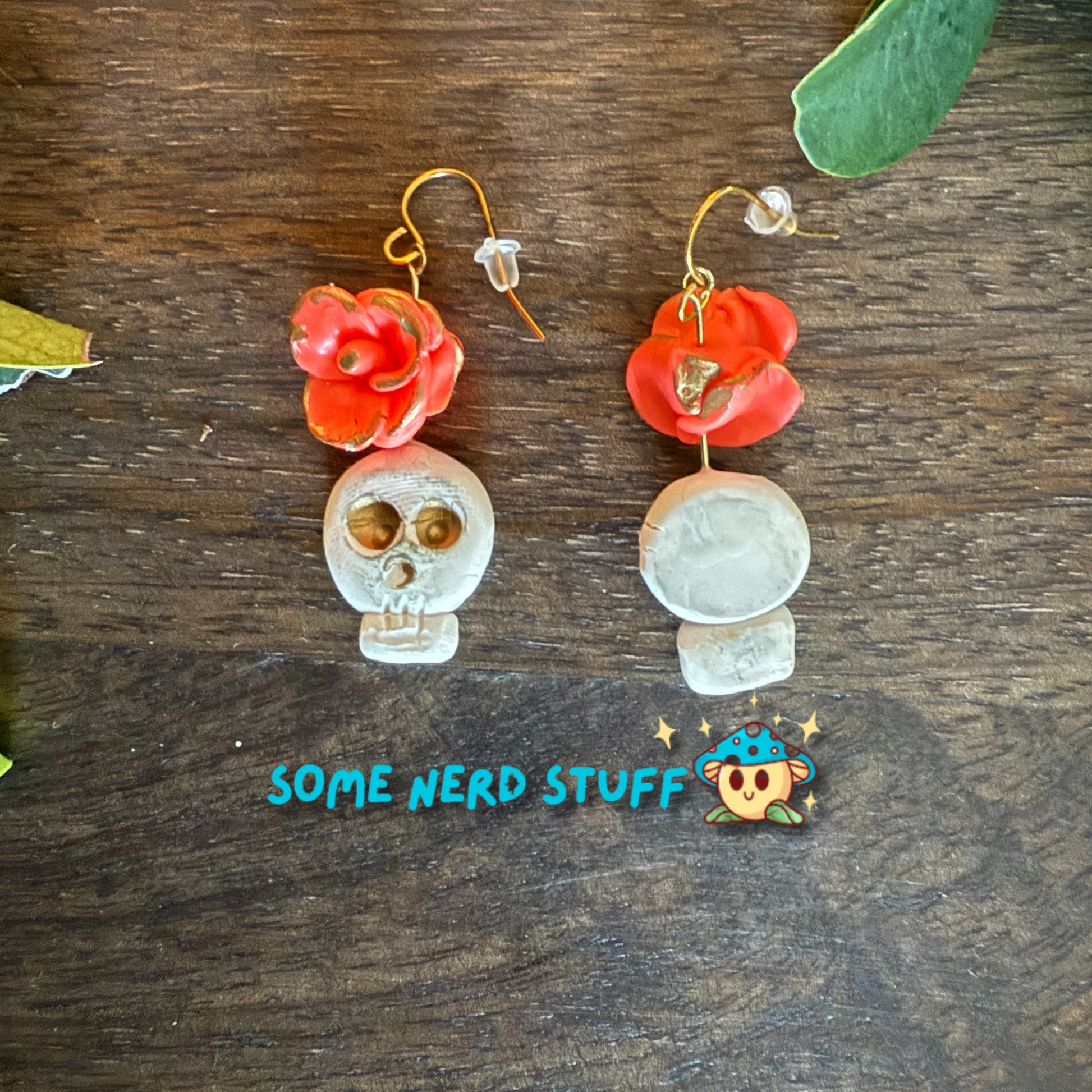 Polymer Clay Wild Rose and Aged Skull highlighted with gold Earrings made by SomeNerdStuff