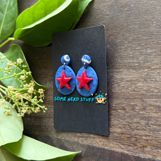 Super hero polymer clay inspired blue and red star earrings side view made by SomeNerdStuff