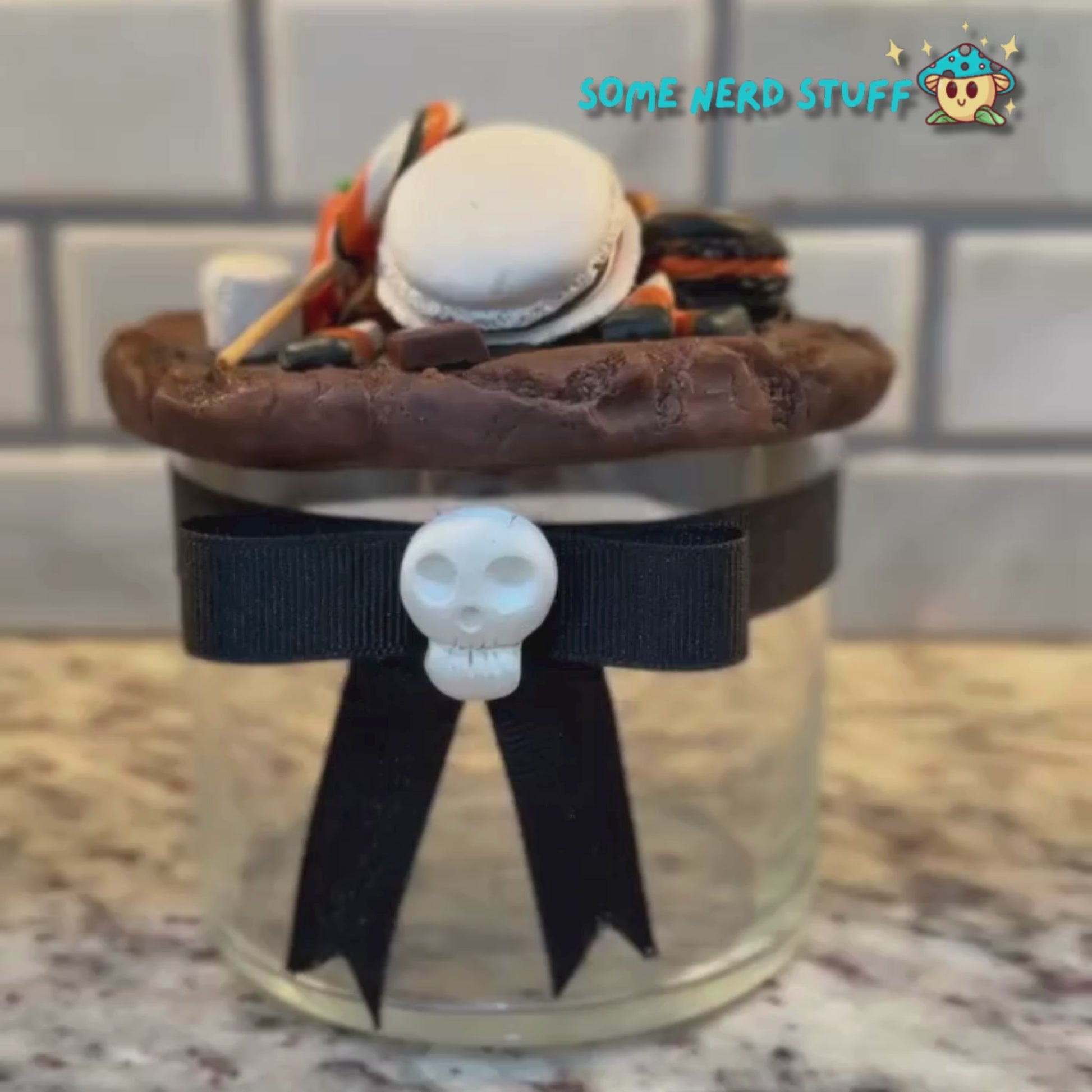 Spooktacular Stash Jar made with polymer clay including macarons, marshmellos, candy lollipop, candy corn, and candy corn pumpkin.